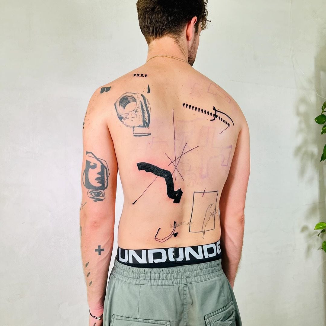 Street art-inspired tattoo by Andrii Volkov documenting found textures and cracks from Amsterdam urban environment