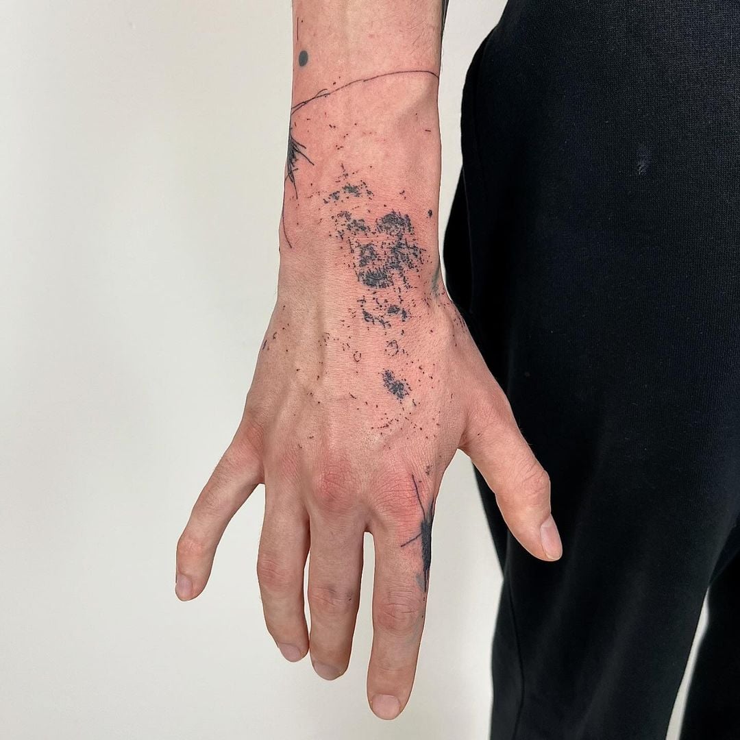 Modern tattoo artwork by Andrii Volkov transforming ordinary street markings into extraordinary permanent artistic expression
